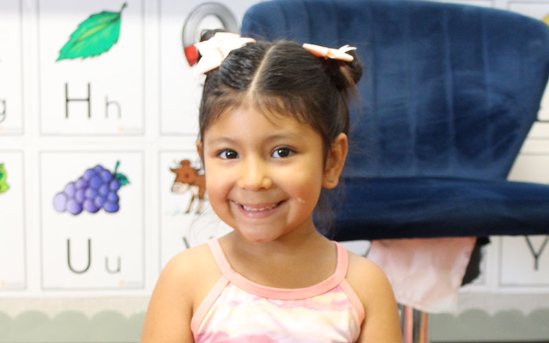 cute little girl in classroom