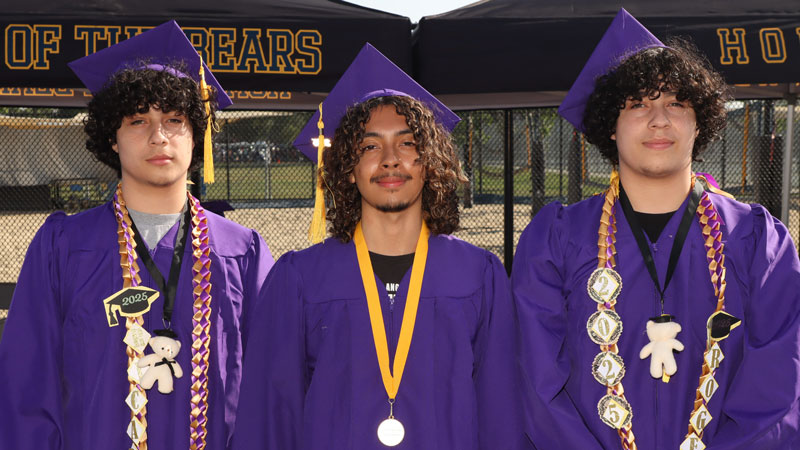 Proud graduates and purple regalia