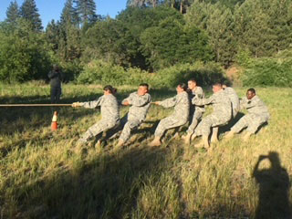 students in uniform tug of war