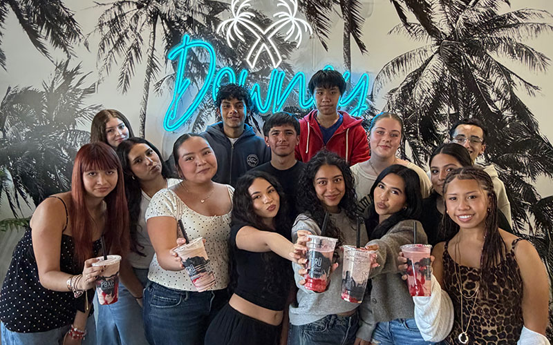 DHS students showing off the smoothies they designed with a local business