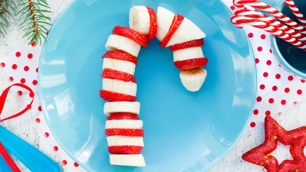 Strawberry and banana slices in the shape of a candy cane.