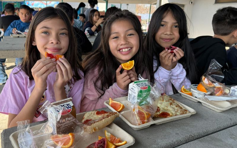 elementary students enjoying their cafeteria lunch