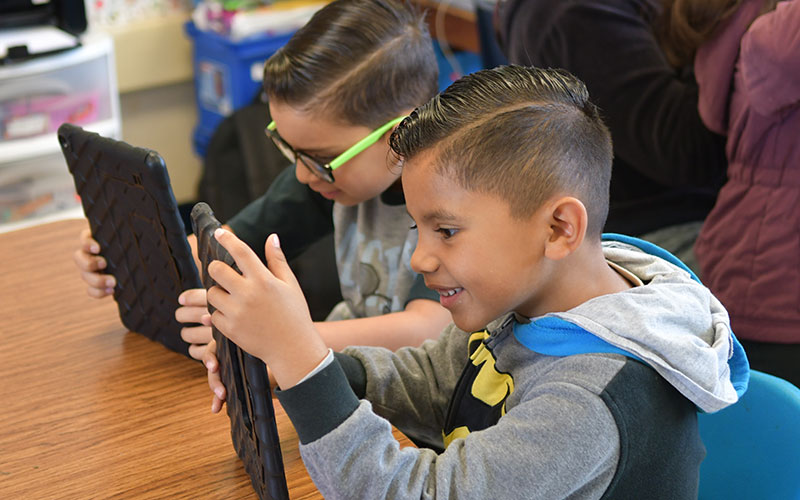 Girls showing off their sunglasses and T-shirts