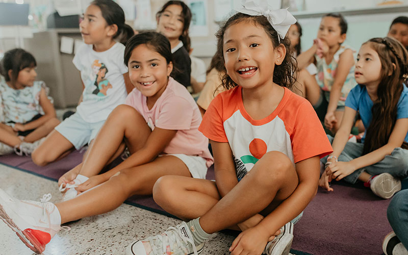 girl at board demonstrating