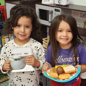 Little girls smiling at the camera