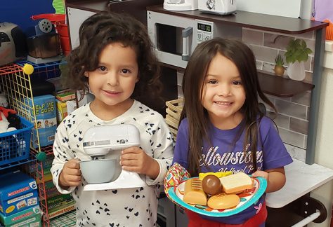 Little girls smiling at the camera