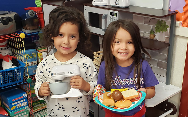 Little girls smiling at the camera