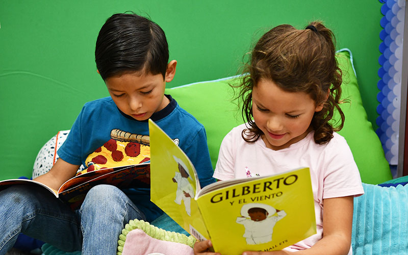 Two students reading books