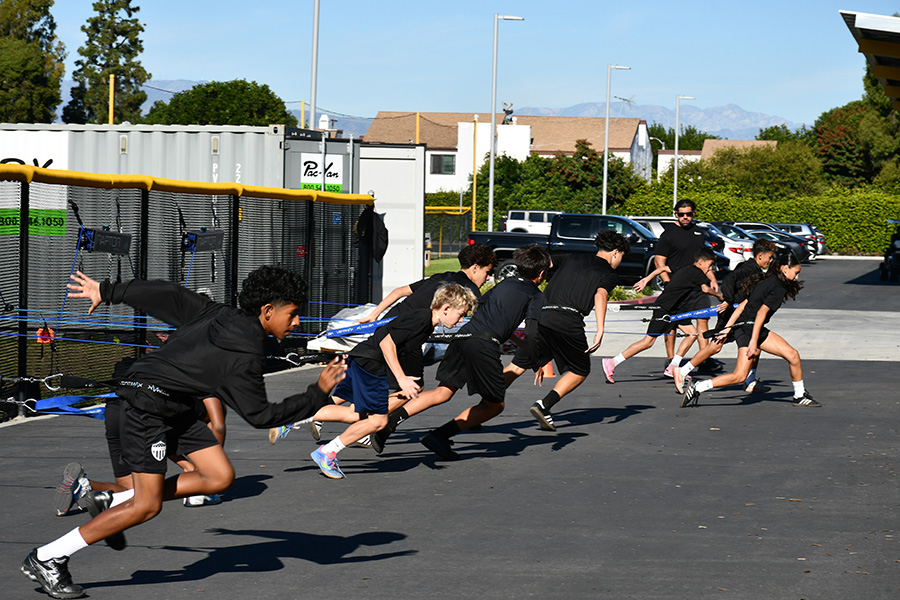 Students running and working on strength training