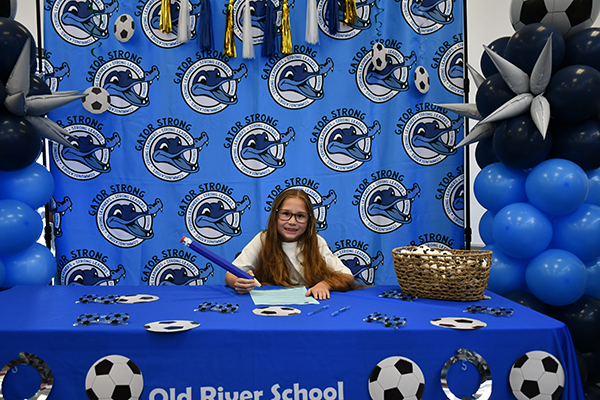signing day with little girl