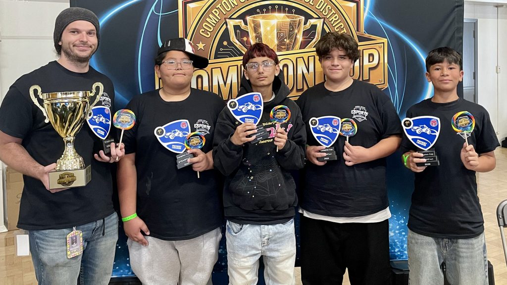 holding trophies at the compton cup