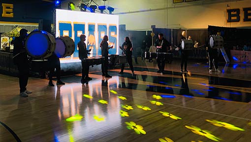 band performing in a dark auditorium