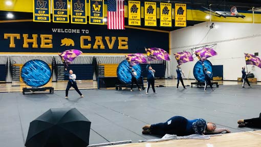 color guard performing at the cave