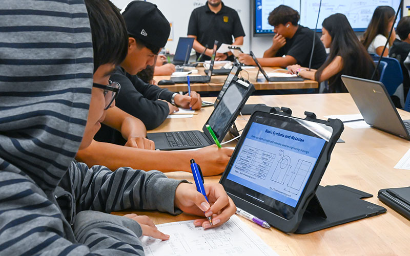 Girl working on a manufacturing equipment