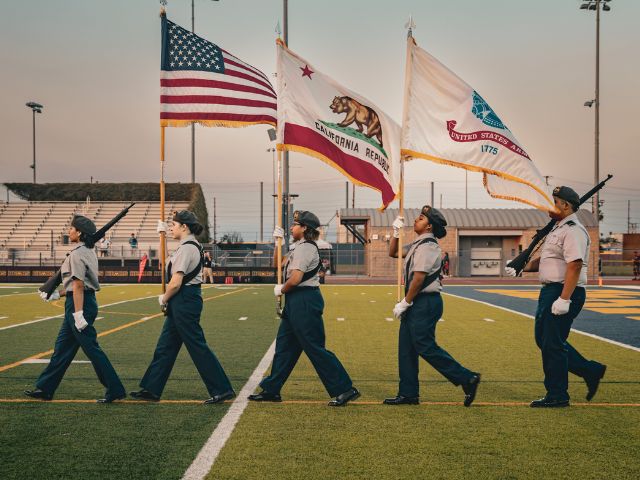 jrotc marchig wth flag
