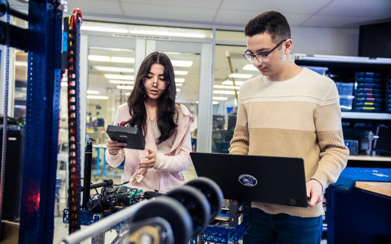 students testing robot functionality