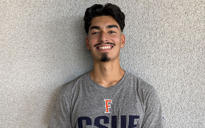 student in s CSUF shirt