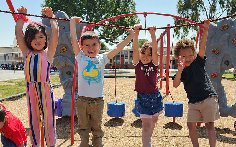 students on monkey bars