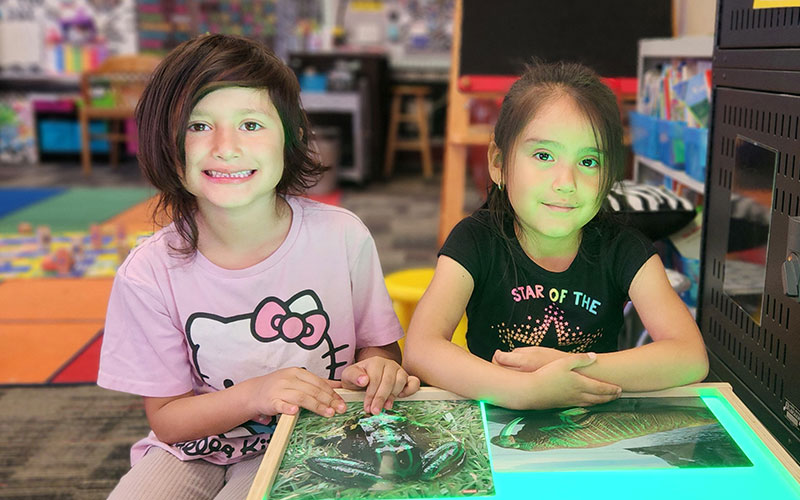little girls at light table