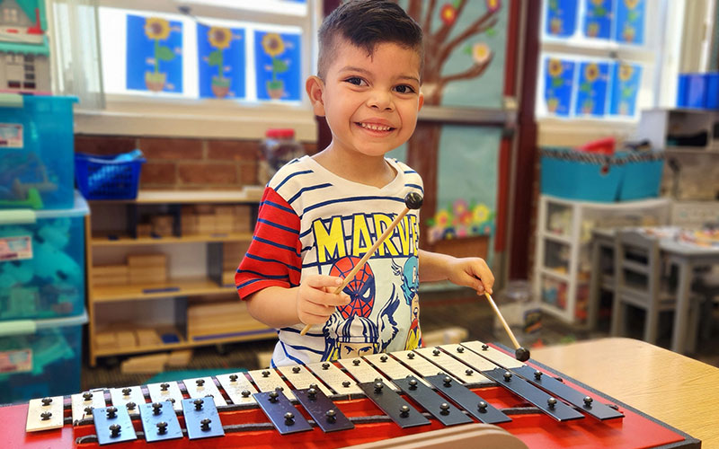 boy plaing a music instrument