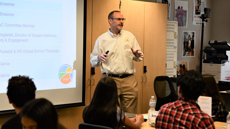 Dr. Brossmer at a meeting