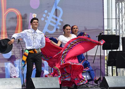 Folklorico students dancing on stage