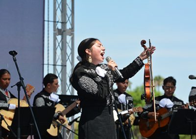 student performer singing at the Downey Unified Mariachi festival