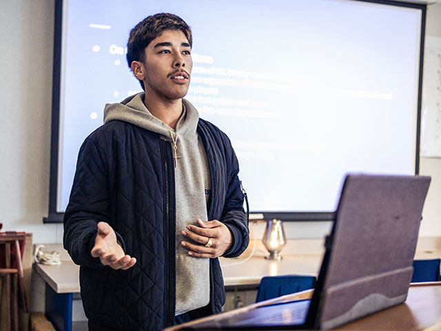 student presenting to a class confidently