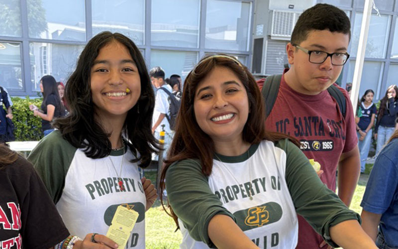 avid students working a booth at the event