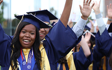 students during graduation cheering